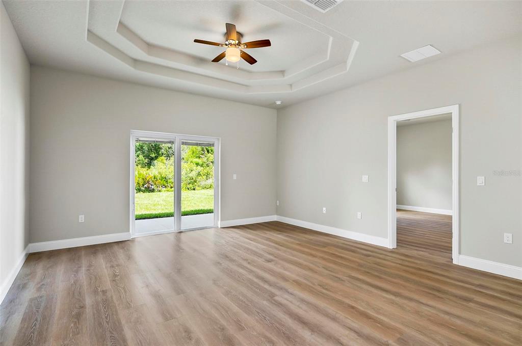 43 Eton Lane, Unit A Palm Coast, FL 32164 - Photo 72 of 78 wooden floor in an empty room with a window