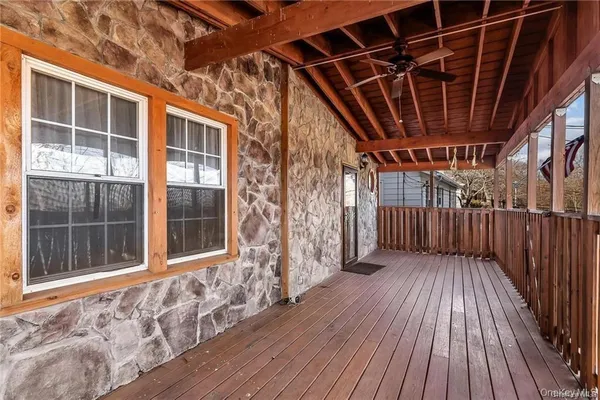 a view of porch with wooden floor