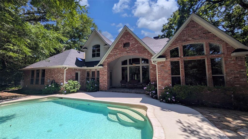 7451 County Road 1509 Athens, TX 75751 - Photo 24 of 36 a front view of a house with a yard and porch