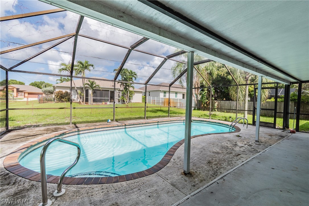 17552 Lebanon Road Fort Myers, FL 33967 - Photo 15 of 35 a view of a swimming pool with a porch