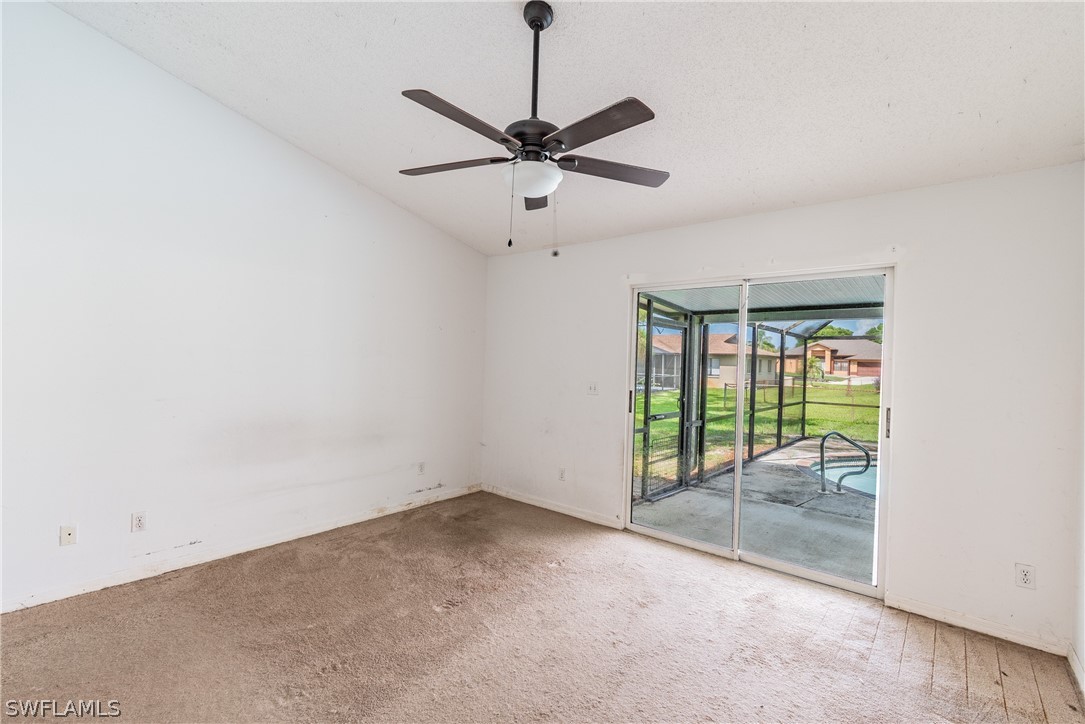 17552 Lebanon Road Fort Myers, FL 33967 - Photo 23 of 35 a view of a livingroom with wooden floor and a ceiling fan