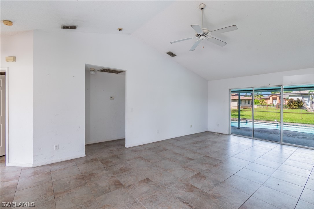 17552 Lebanon Road Fort Myers, FL 33967 - Photo 27 of 35 a view of an empty room with a floor to ceiling window and a ceiling fan