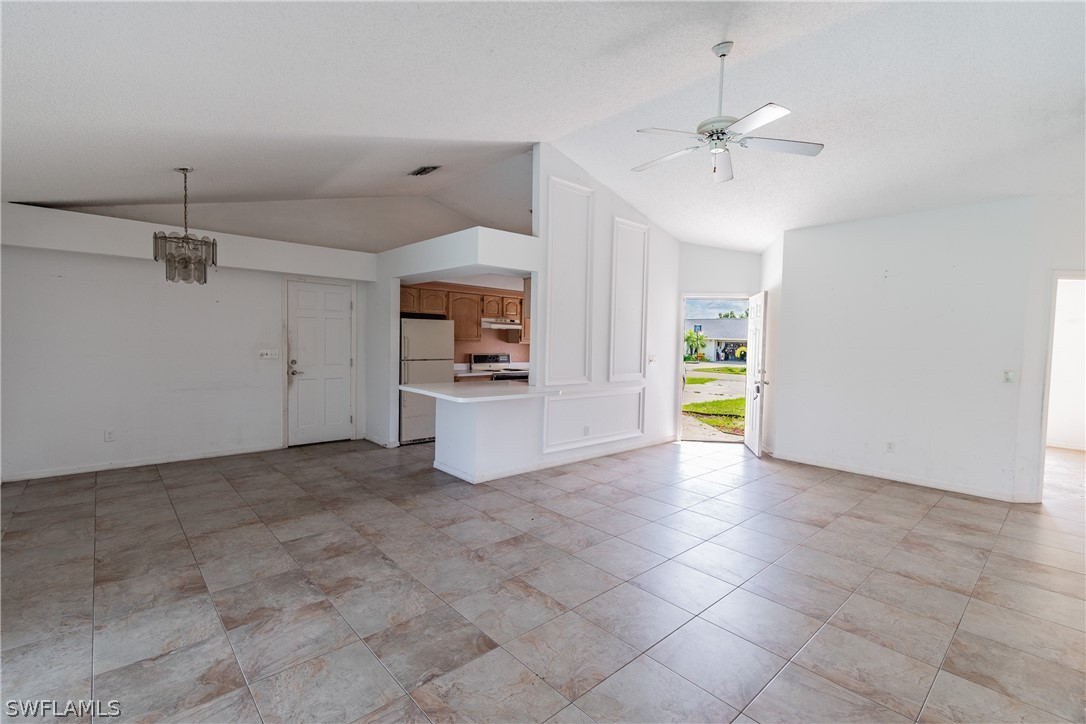 17552 Lebanon Road Fort Myers, FL 33967 - Photo 29 of 35 a view of a kitchen with a sink and a refrigerator a microwave