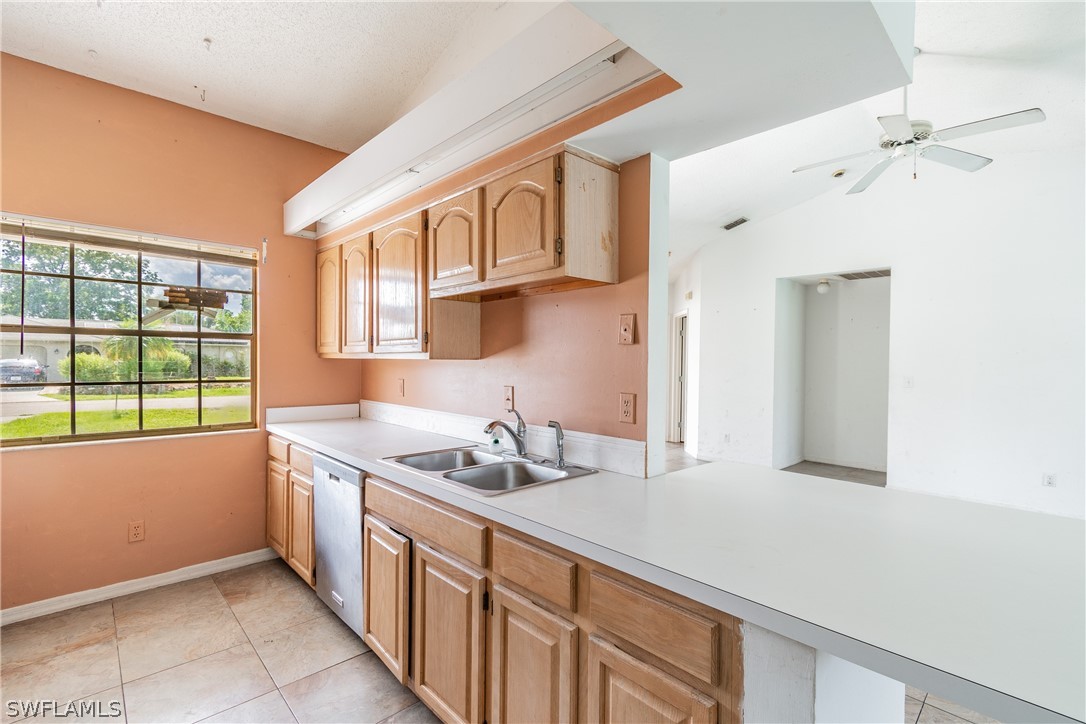 17552 Lebanon Road Fort Myers, FL 33967 - Photo 33 of 35 a kitchen with stainless steel appliances granite countertop a sink and a white cabinets