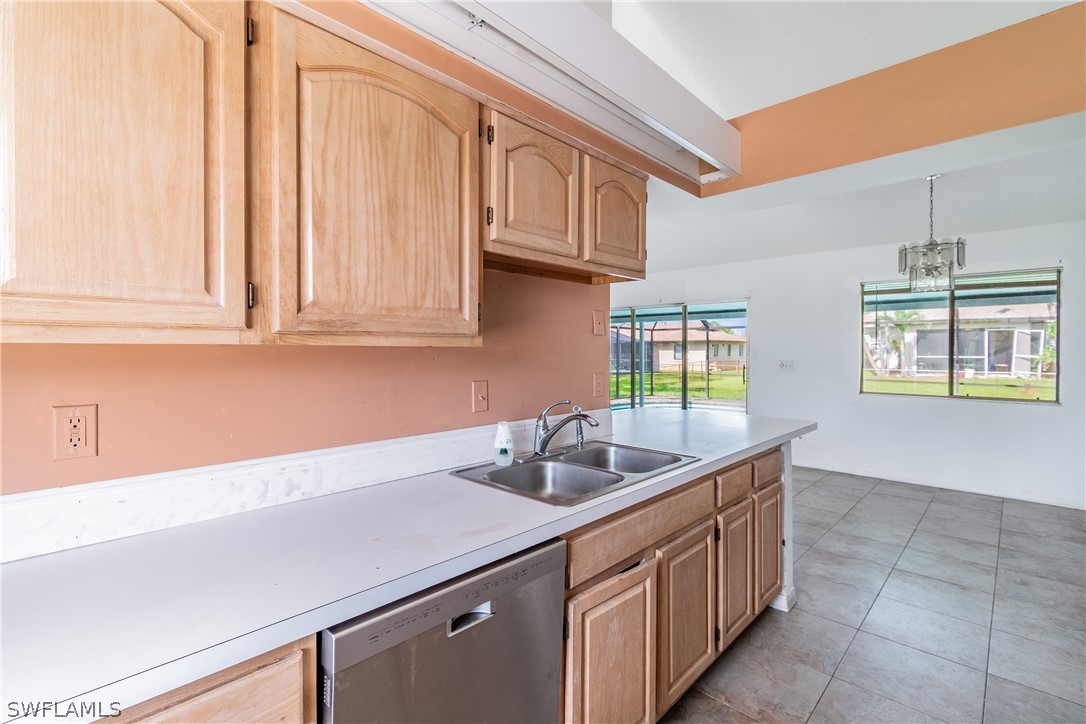 17552 Lebanon Road Fort Myers, FL 33967 - Photo 35 of 35 a kitchen with stainless steel appliances granite countertop a sink and a white cabinets