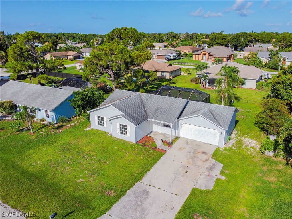 17552 Lebanon Road Fort Myers, FL 33967 - Photo 4 of 35 an aerial view of residential houses with outdoor space and trees