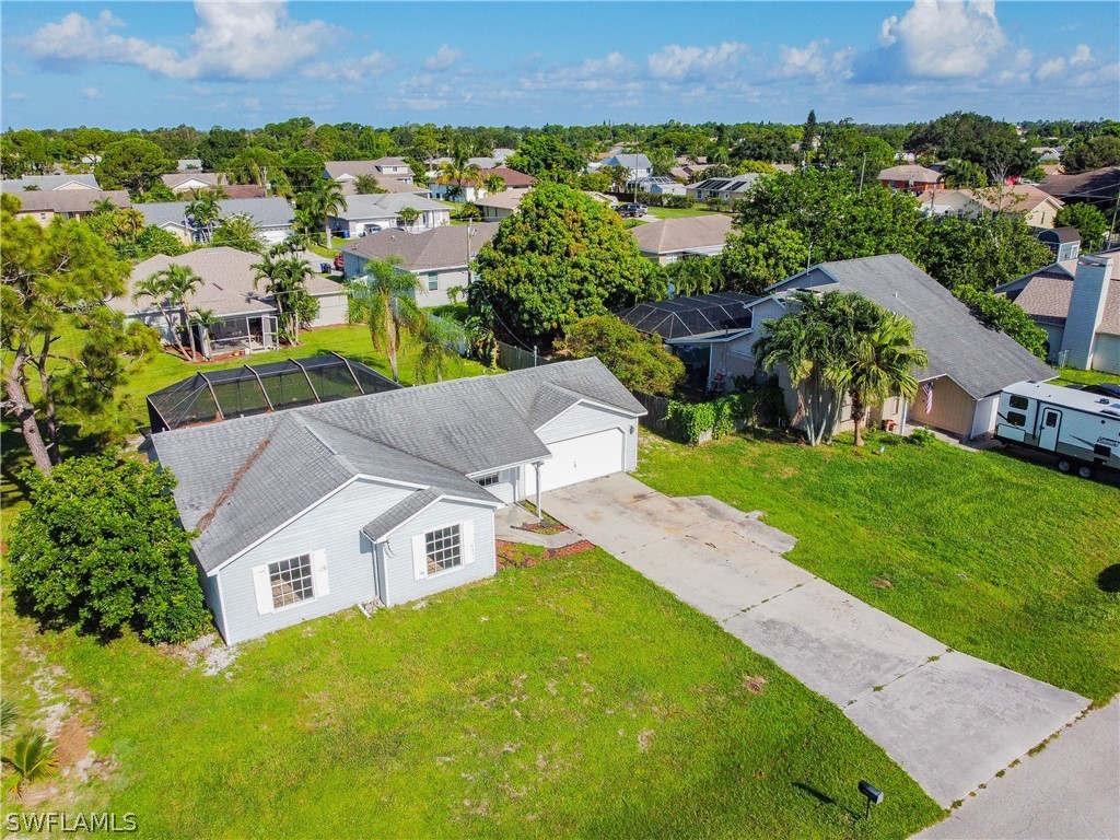 17552 Lebanon Road Fort Myers, FL 33967 - Photo 5 of 35 an aerial view of residential houses with outdoor space and trees