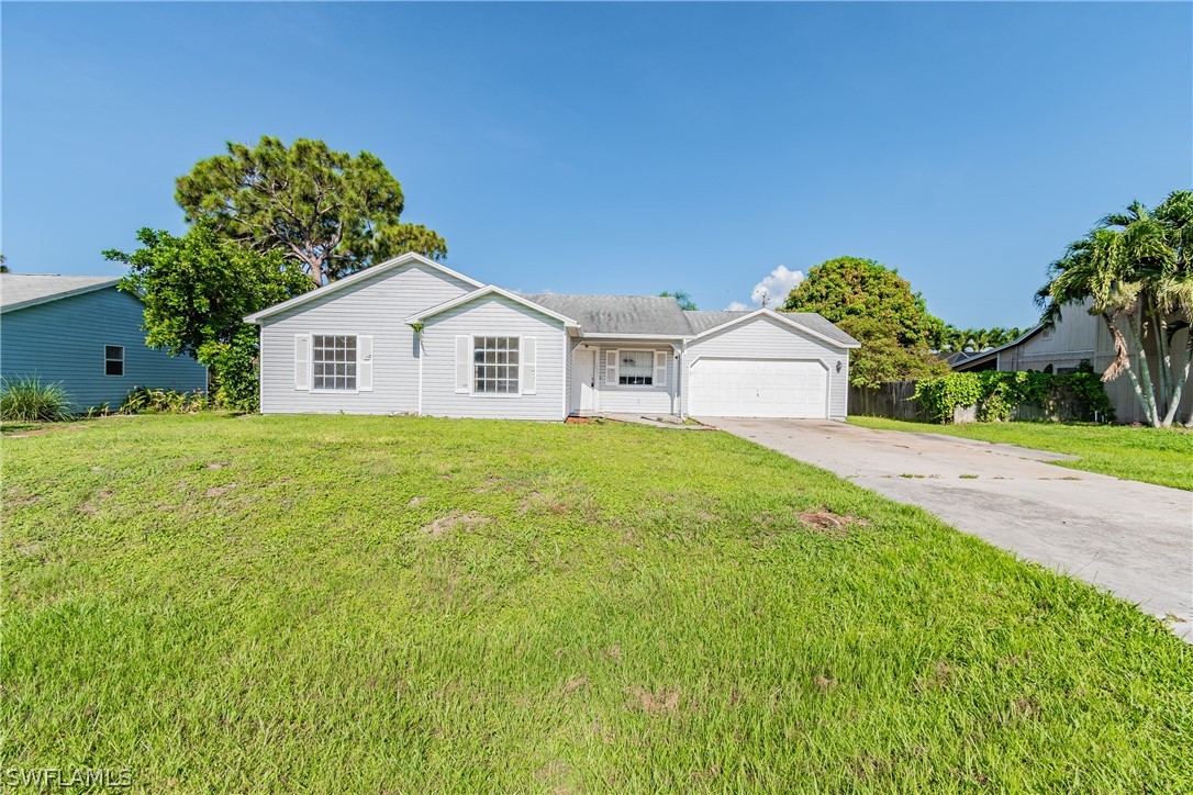 17552 Lebanon Road Fort Myers, FL 33967 - Photo 9 of 35 a house view with a garden space