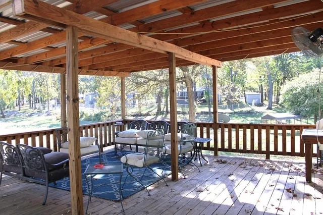 a view of a patio with wooden floor outdoor seating