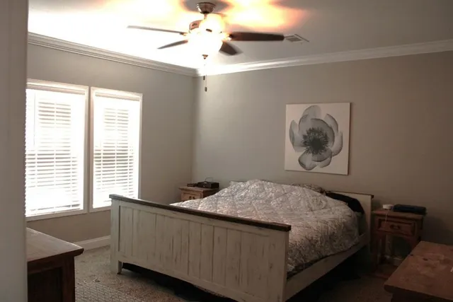 a bedroom with a bed and window