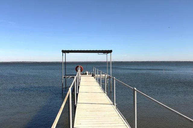 a view of a balcony with wooden floor