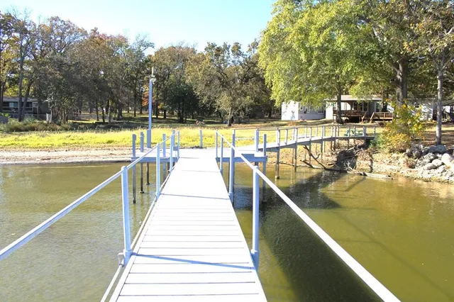 a view of swimming pool with chairs