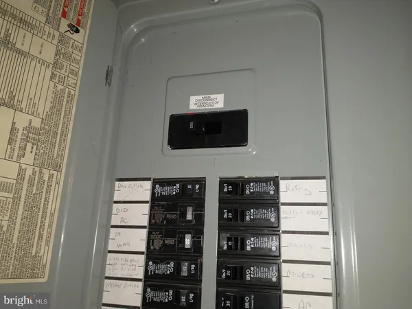 a view of a hallway with wooden floor and entryway