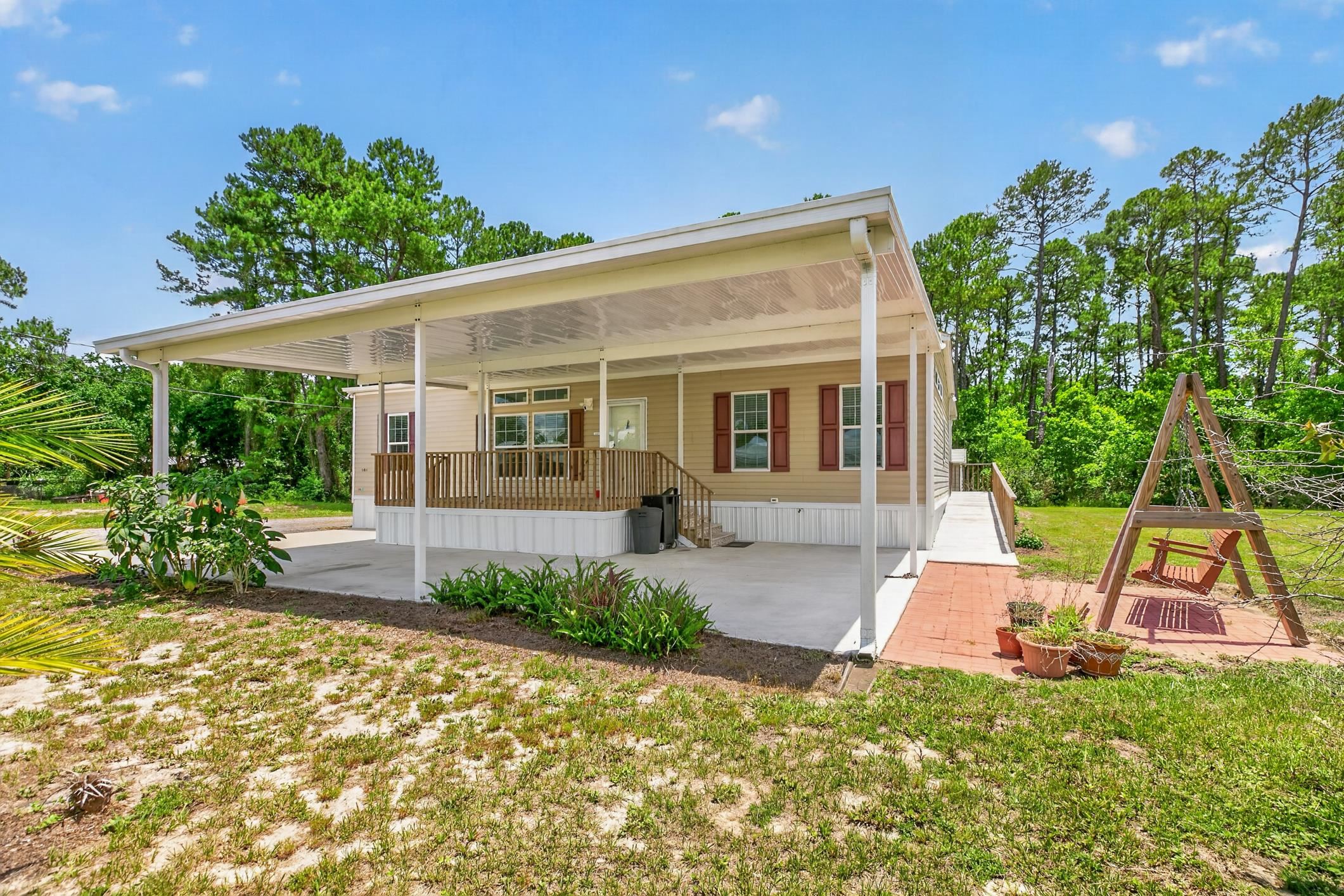 101 Trout Trail Crescent City, FL 32112 - Photo 3 of 45 a view of a house with backyard sitting area and porch
