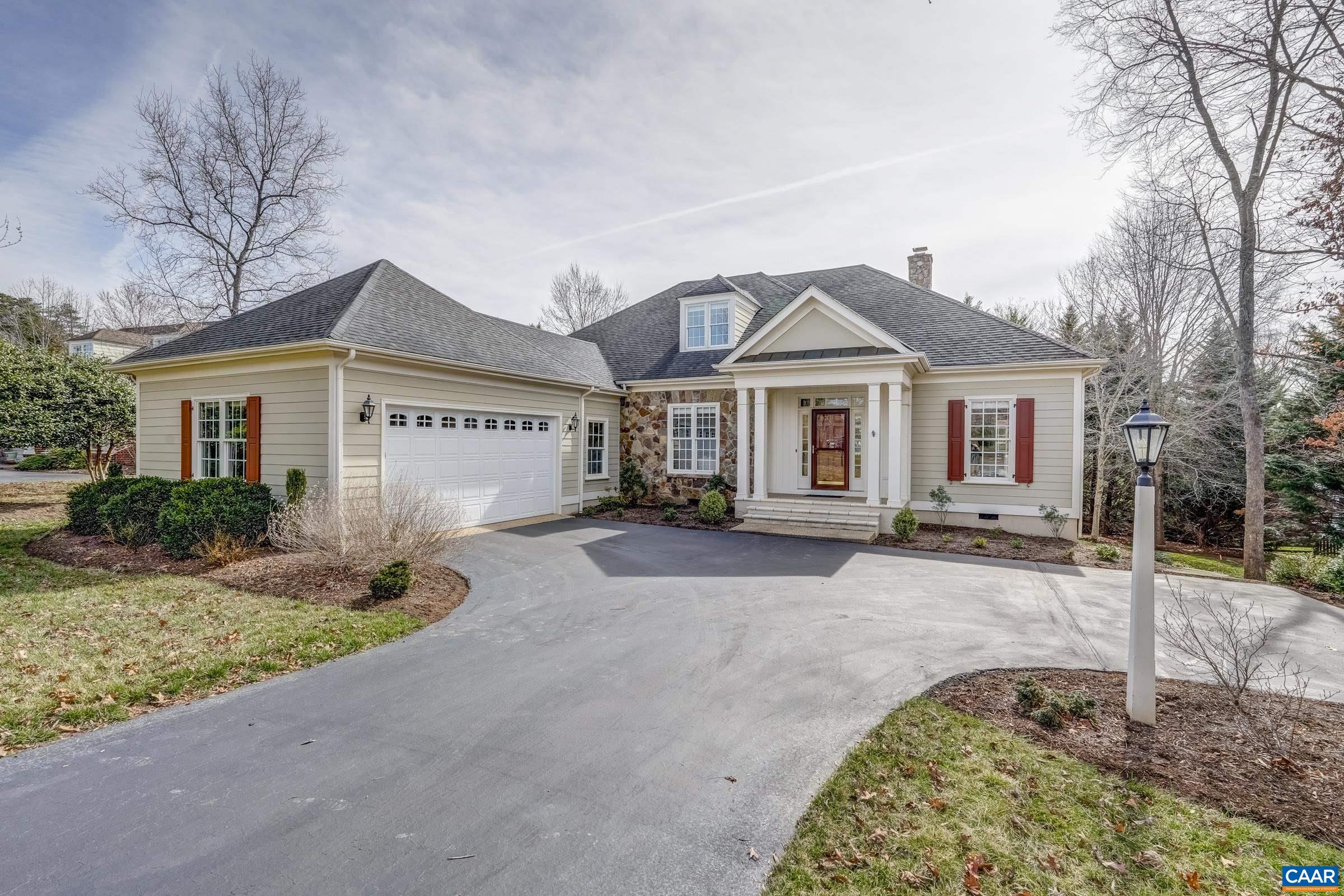 3434 Darby Road Keswick, VA 22947 - Photo 1 of 45 a front view of a house with a yard and garage