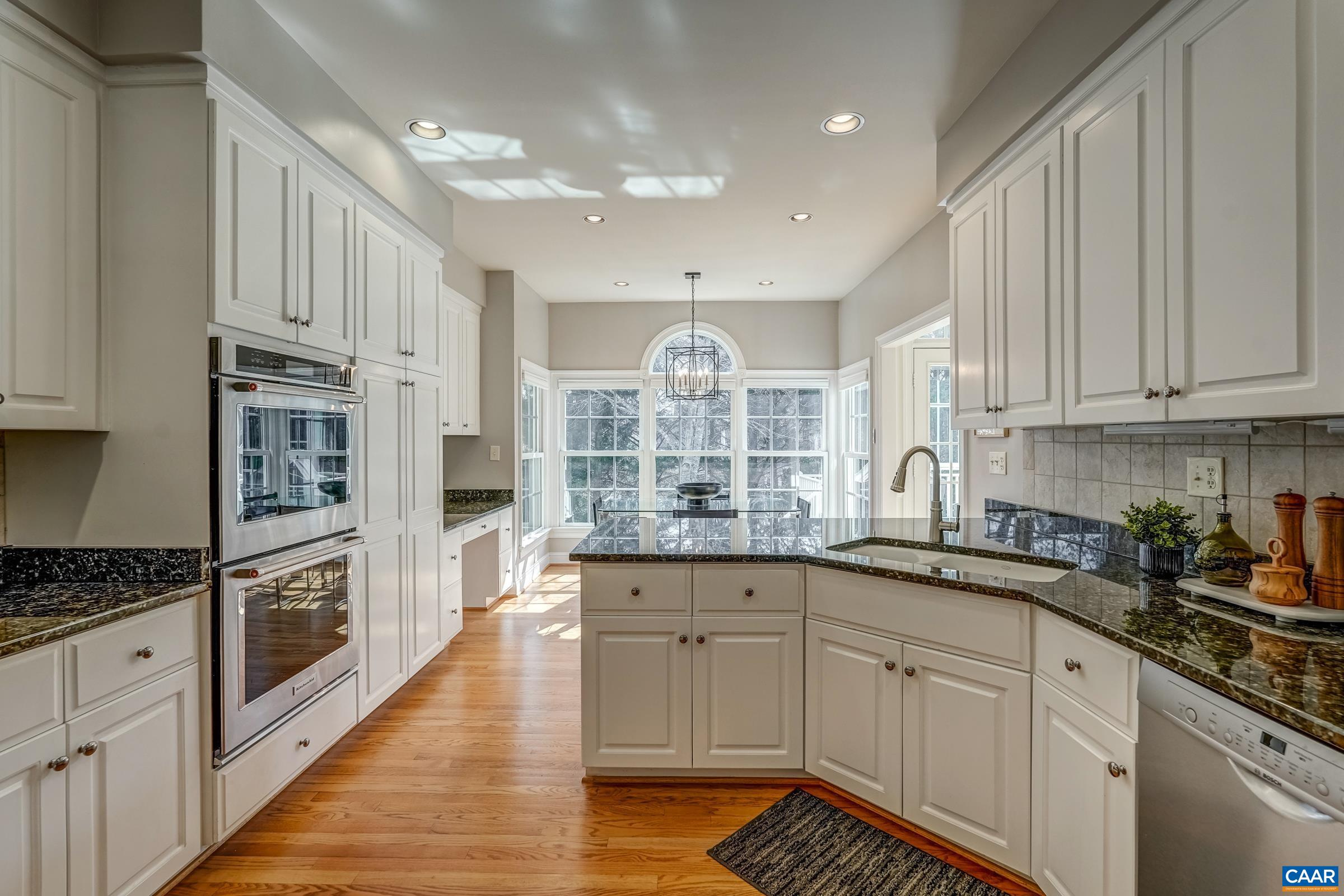 3434 Darby Road Keswick, VA 22947 - Photo 15 of 45 a kitchen with granite countertop a sink and cabinets