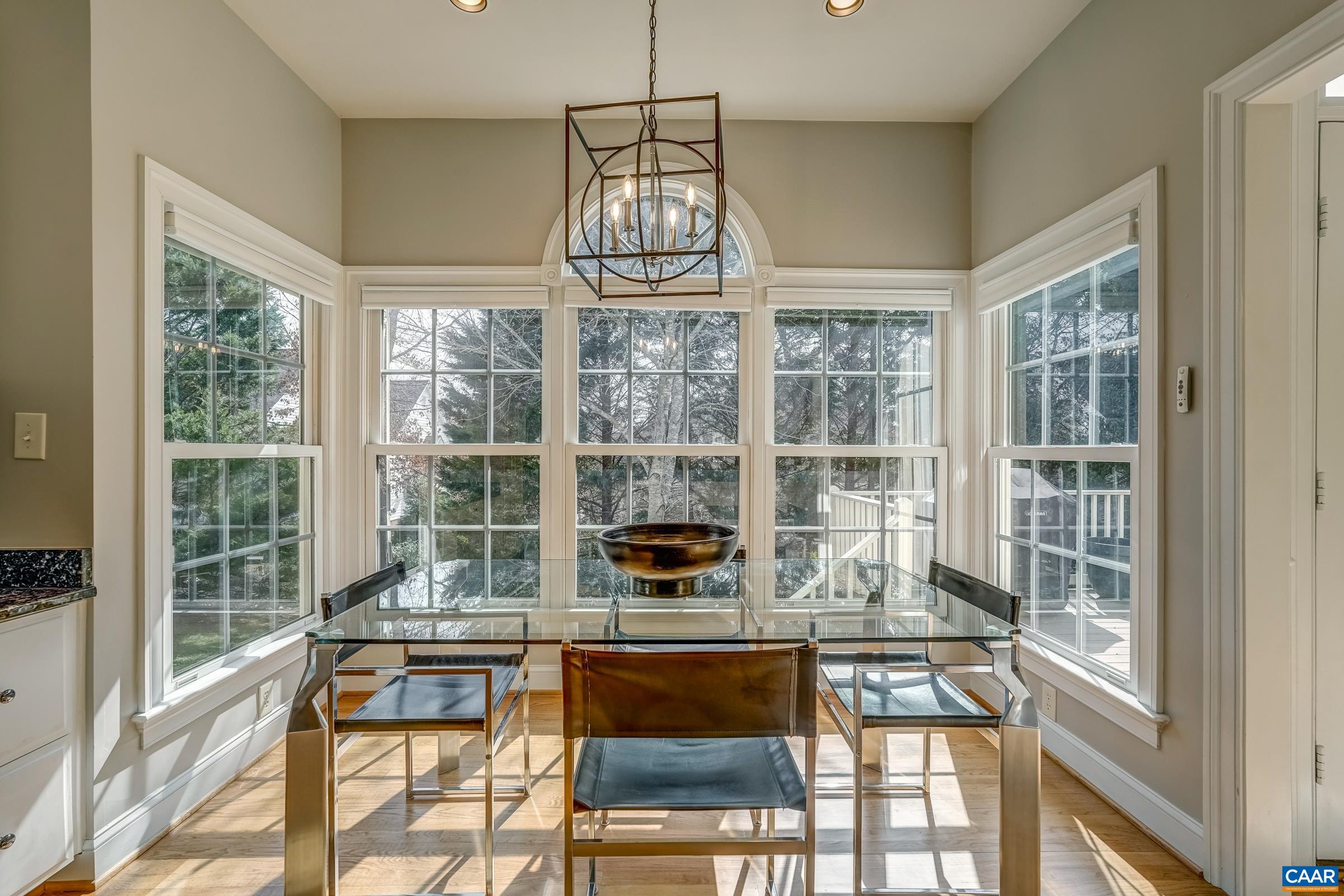 3434 Darby Road Keswick, VA 22947 - Photo 18 of 45 a dining room with a table and chairs