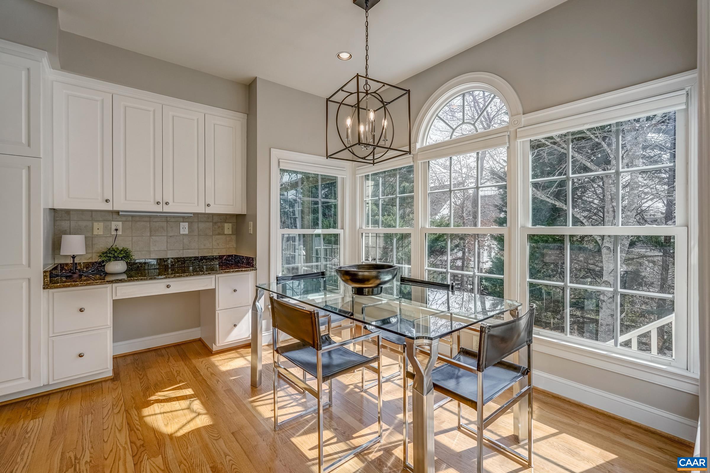 3434 Darby Road Keswick, VA 22947 - Photo 19 of 45 a view of a dining room with furniture a chandelier and wooden floor