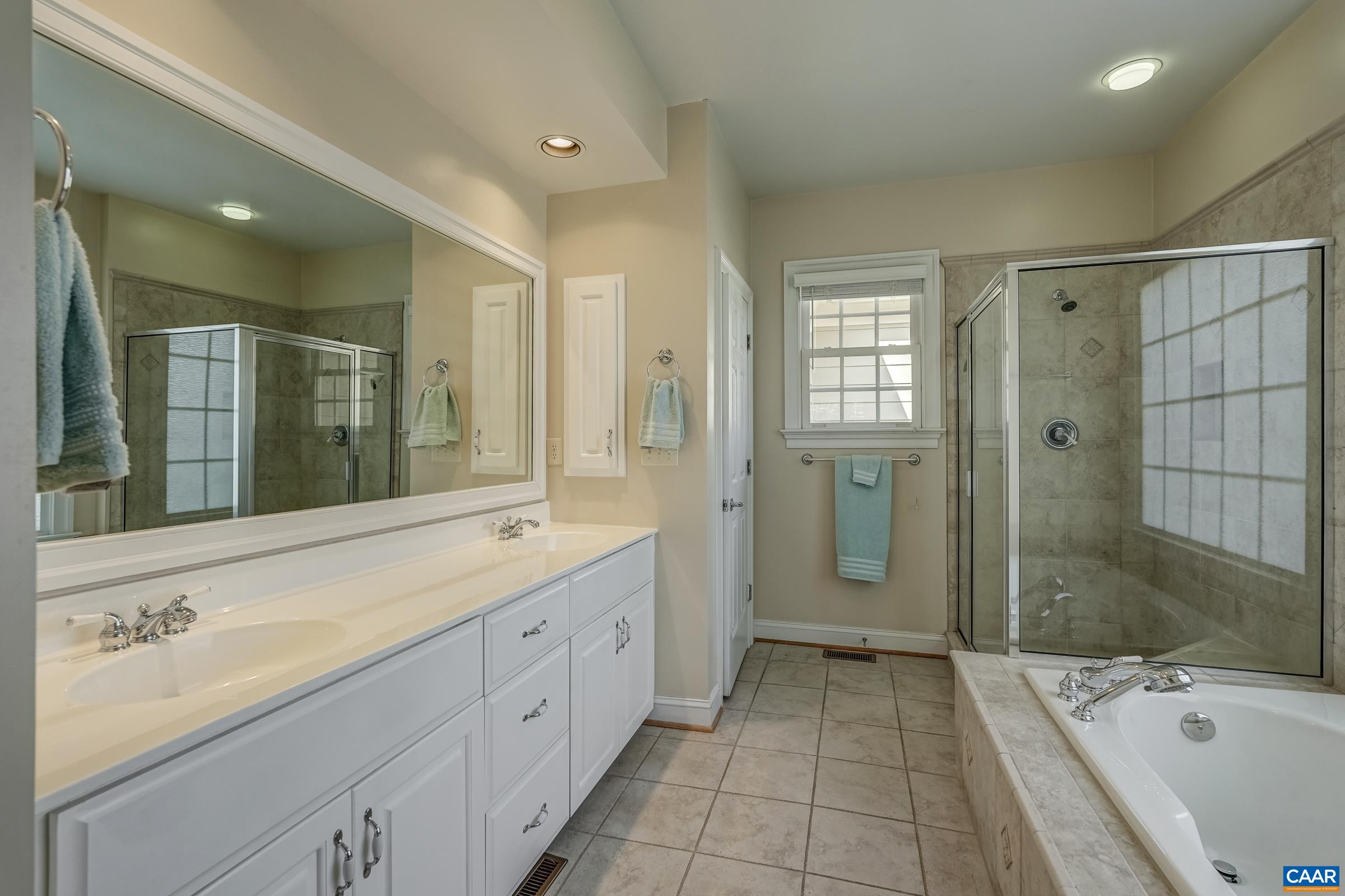 3434 Darby Road Keswick, VA 22947 - Photo 23 of 45 a spacious bathroom with a shower tub double and sink