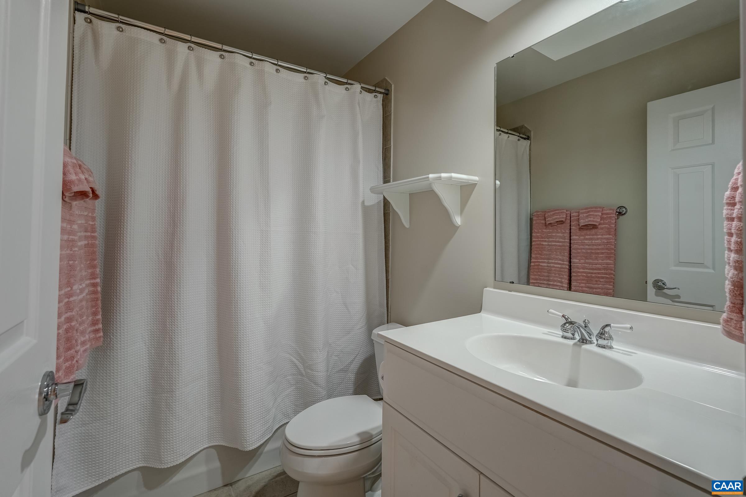 3434 Darby Road Keswick, VA 22947 - Photo 34 of 45 a bathroom with a sink toilet and mirror