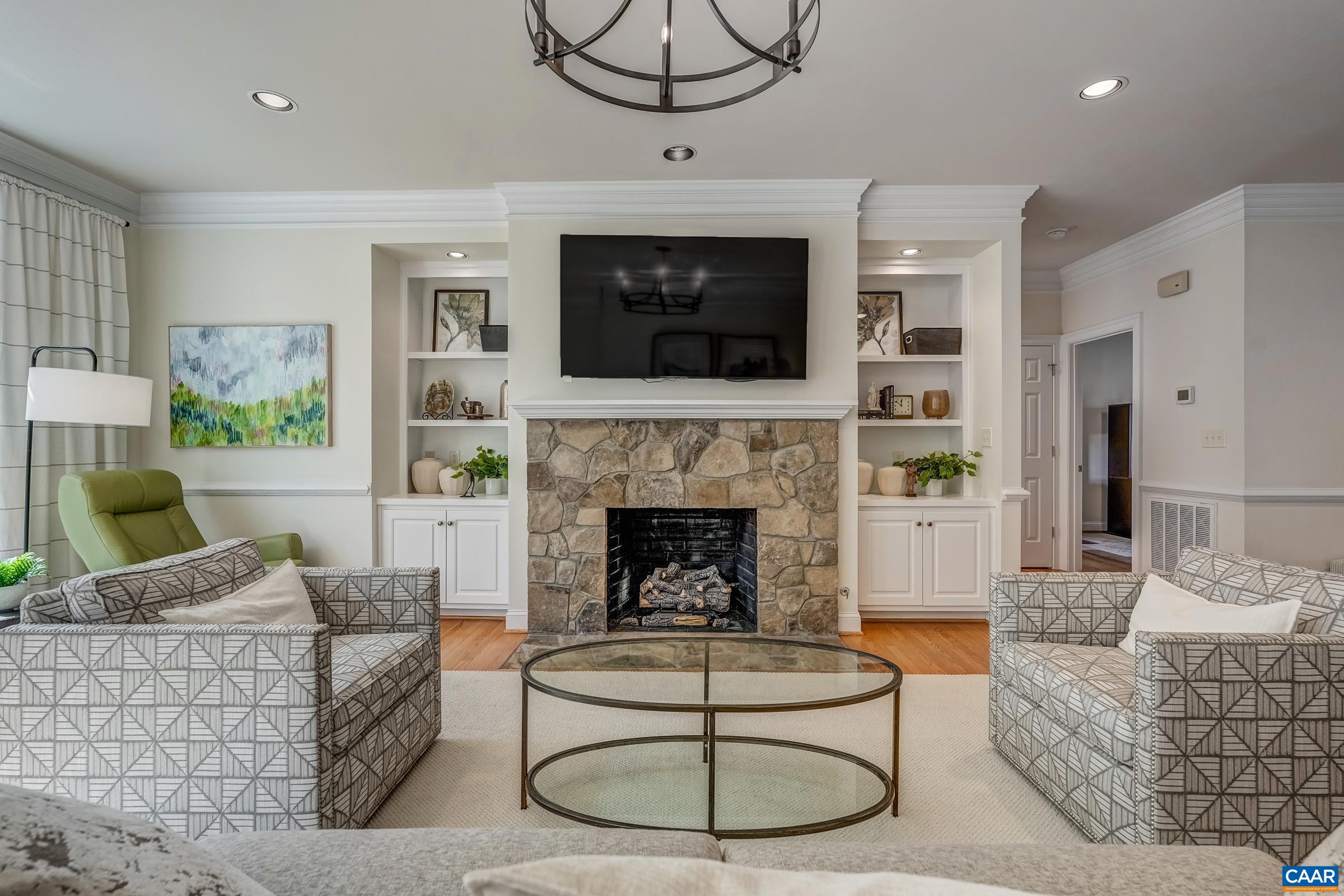 3434 Darby Road Keswick, VA 22947 - Photo 10 of 45 a living room with furniture a flat screen tv and a fireplace