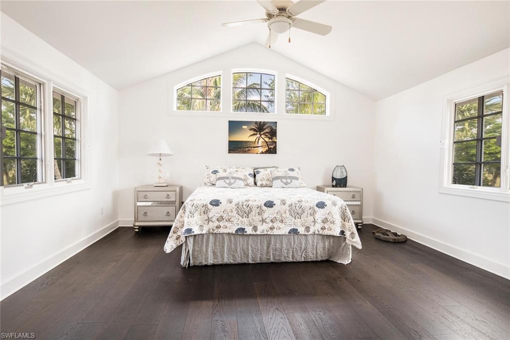 2540 Half Moon Walk Naples, FL 34102 - Photo 35 of 44 a bedroom with a bed wooden floor and window
