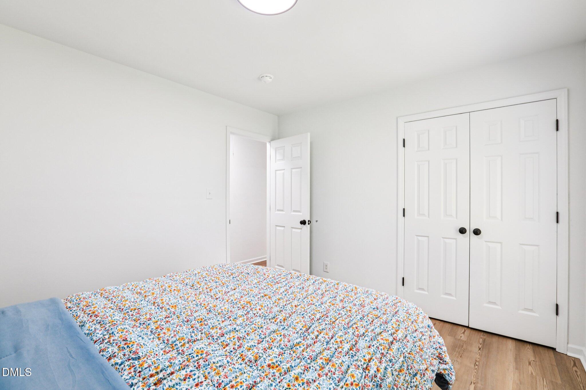 1349 Crabtree Boulevard Raleigh, NC 27610 - Photo 12 of 21 a bedroom with a bed and a window