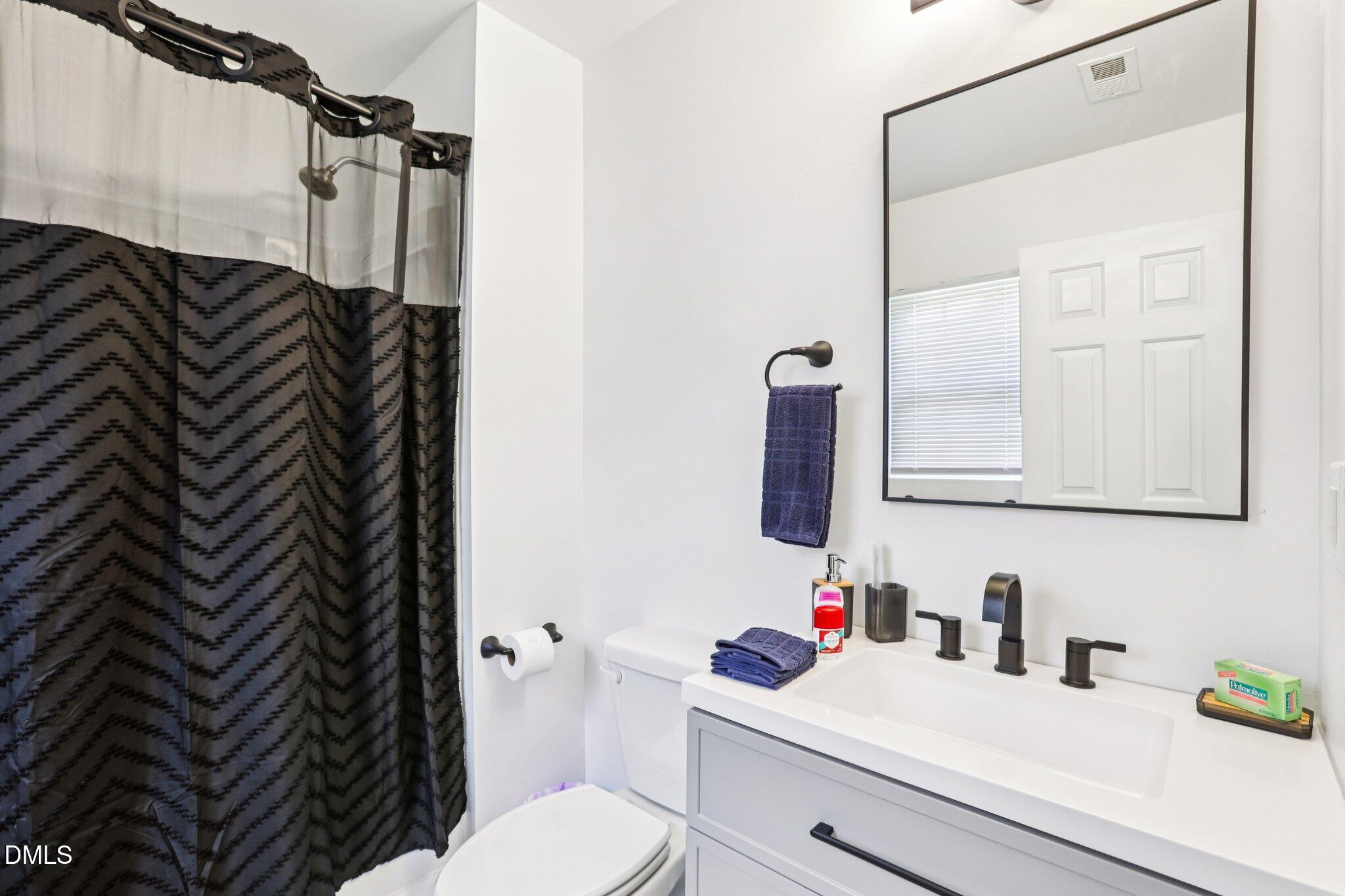 1349 Crabtree Boulevard Raleigh, NC 27610 - Photo 16 of 21 a bathroom with a sink a toilet and shower