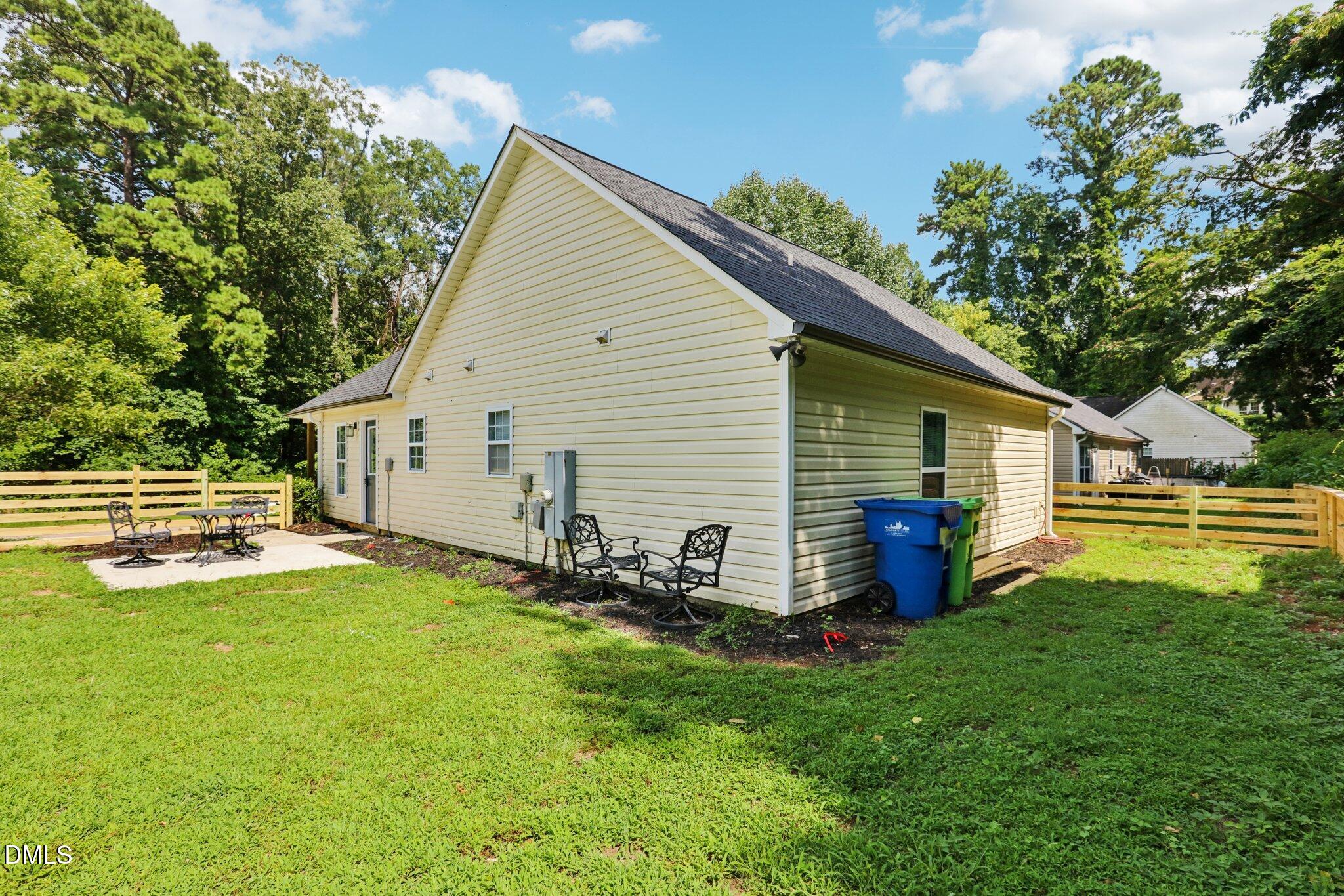 1349 Crabtree Boulevard Raleigh, NC 27610 - Photo 21 of 21 a backyard of a house with table and chairs