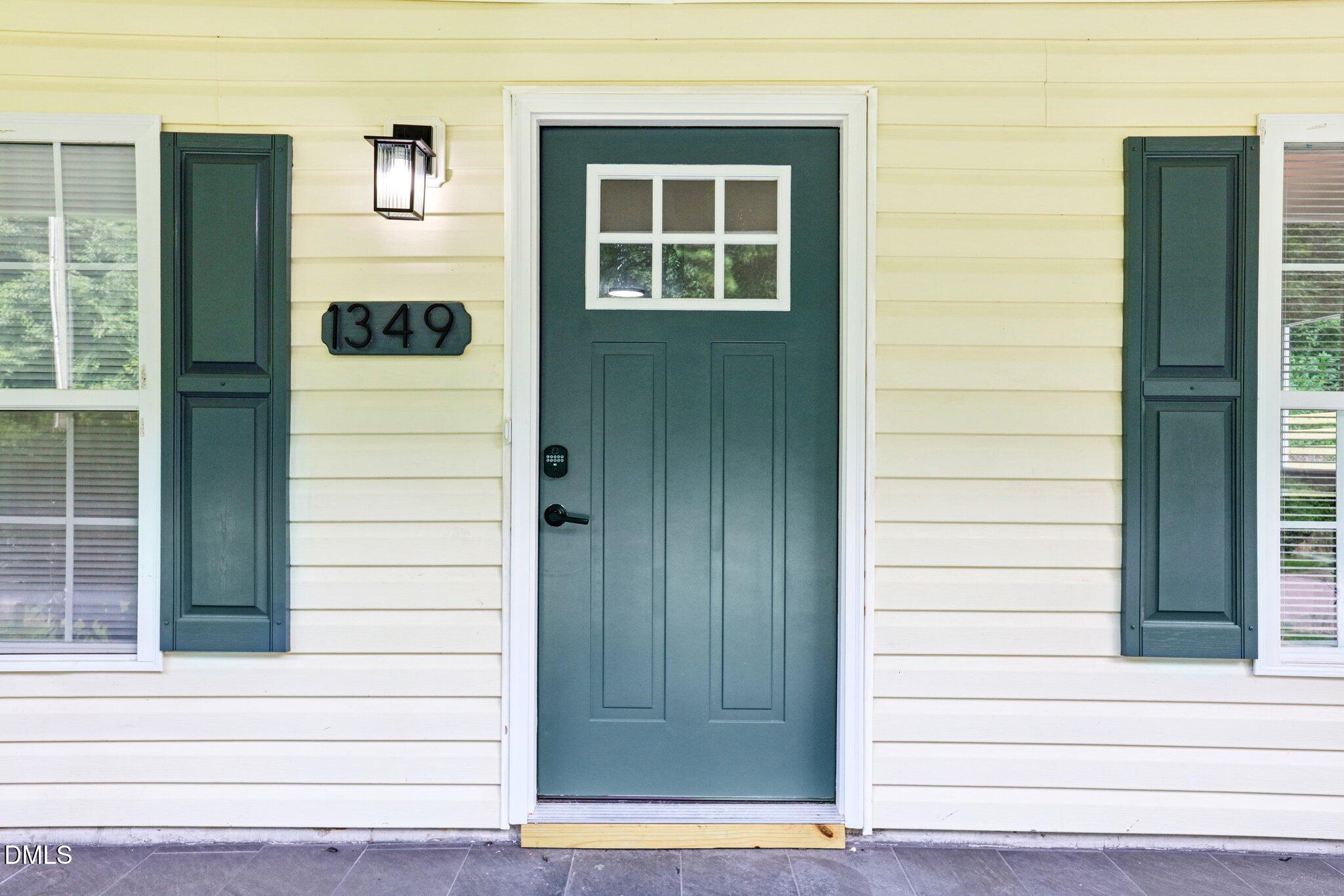 1349 Crabtree Boulevard Raleigh, NC 27610 - Photo 4 of 21 a view of door with wooden door