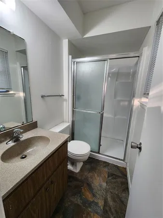 a bathroom with a sink a toilet and bathtub