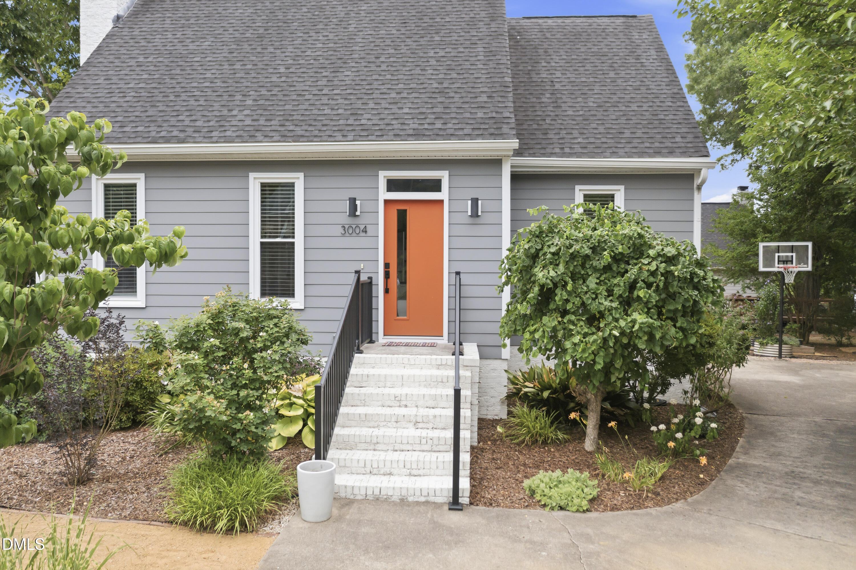 3004 West Annaley Drive Raleigh, NC 27604 - Photo 41 of 44 a front view of a house with a garden