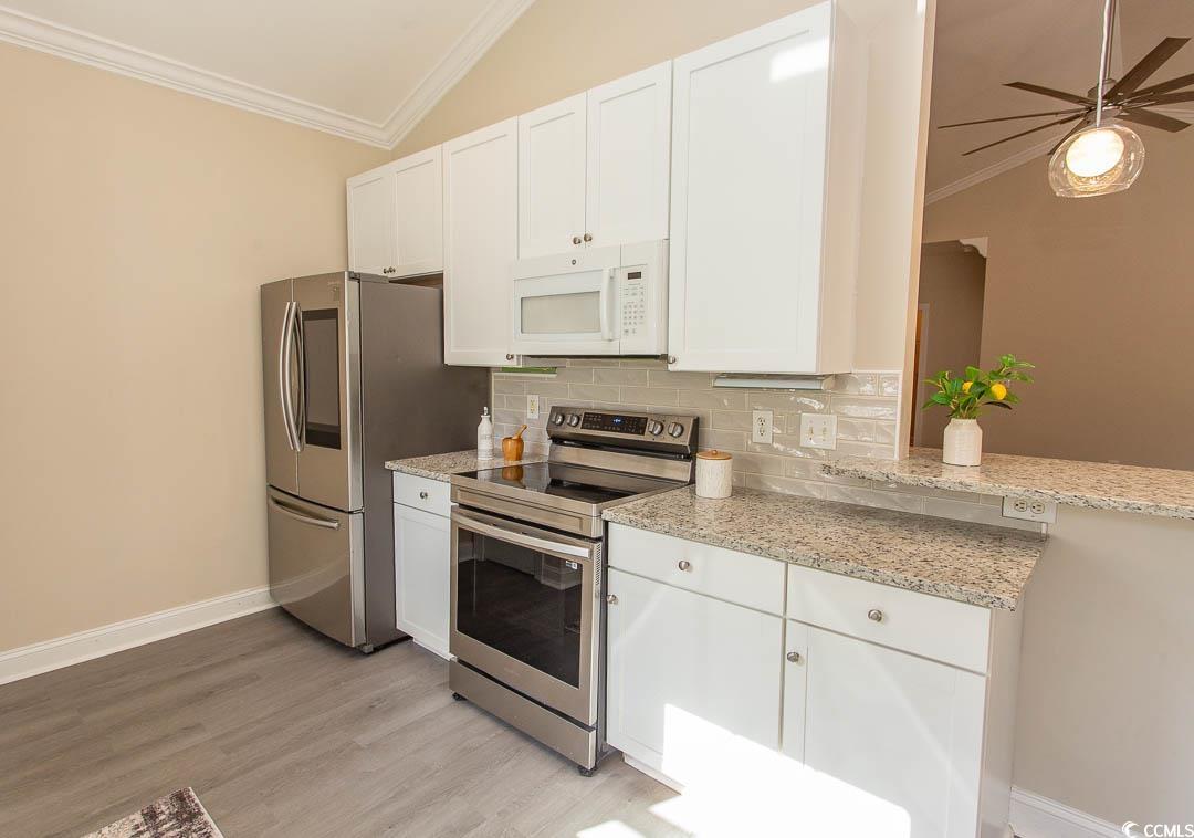 202 Sugar Mill Loop Myrtle Beach, SC 29588 - Photo 11 of 39 Unfurnished dining area with lofted ceiling, a not