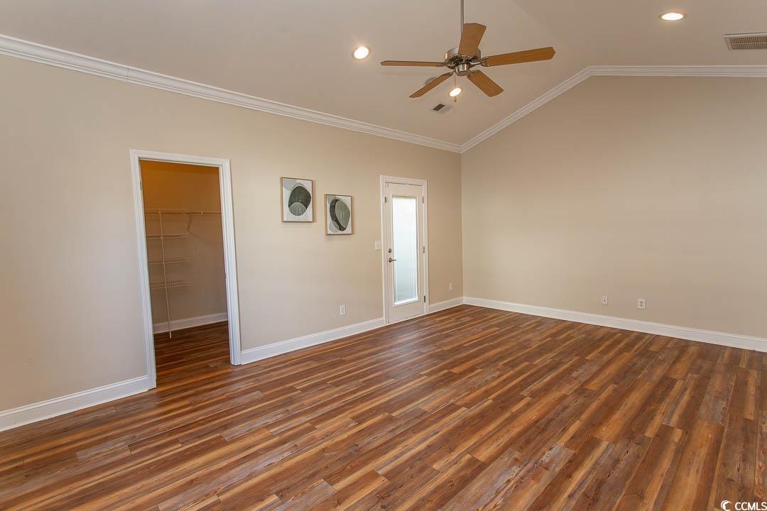 202 Sugar Mill Loop Myrtle Beach, SC 29588 - Photo 25 of 39 Empty room featuring lofted ceiling, dark wood-typ