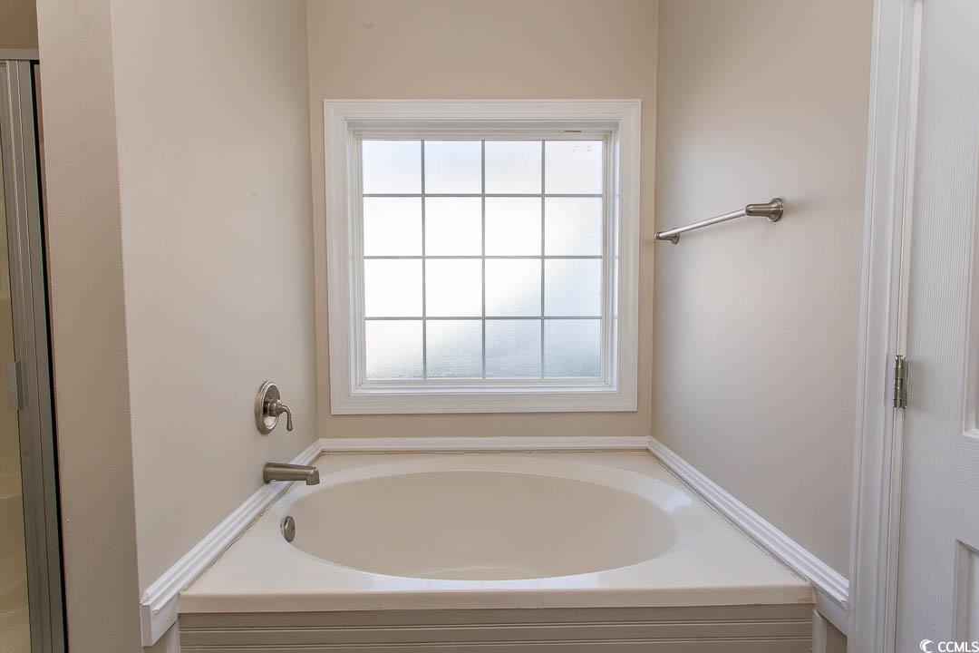 202 Sugar Mill Loop Myrtle Beach, SC 29588 - Photo 29 of 39 Bathroom featuring vanity, separate shower and tub