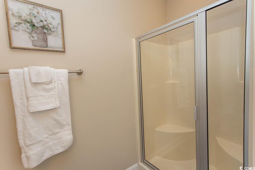 202 Sugar Mill Loop Myrtle Beach, SC 29588 - Photo 30 of 39 Bathroom with a bathtub and plenty of natural ligh