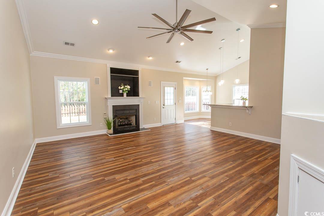 202 Sugar Mill Loop Myrtle Beach, SC 29588 - Photo 3 of 39 Unfurnished living room with a fireplace, ceiling