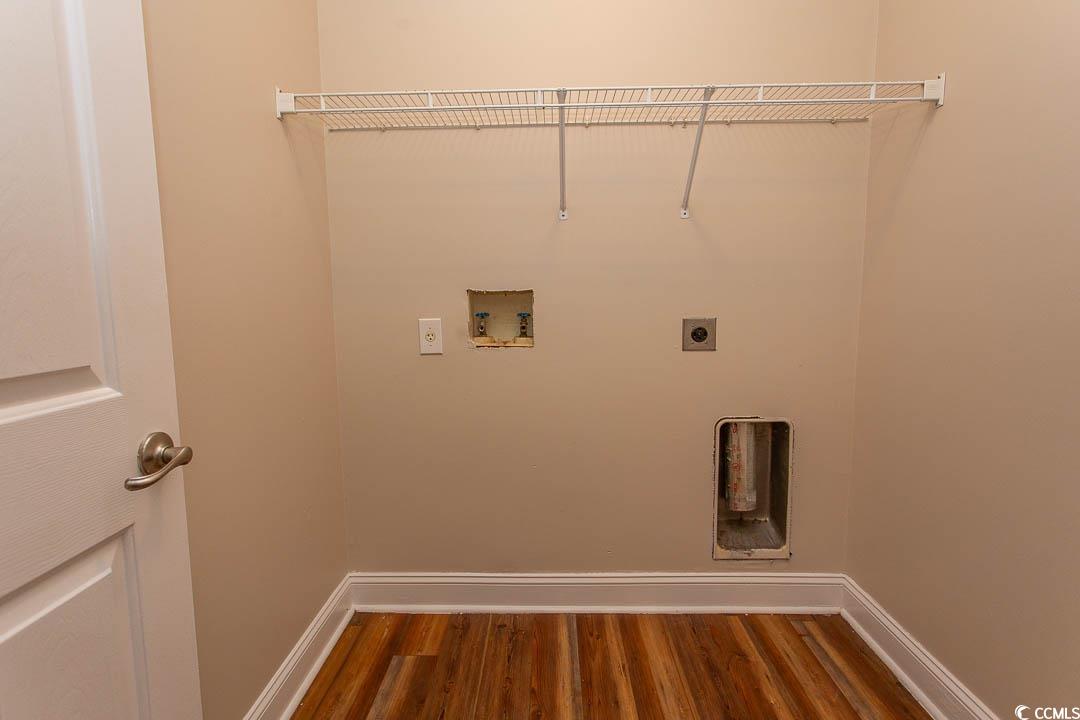 202 Sugar Mill Loop Myrtle Beach, SC 29588 - Photo 32 of 39 Bathroom featuring toilet, wood-type flooring, van