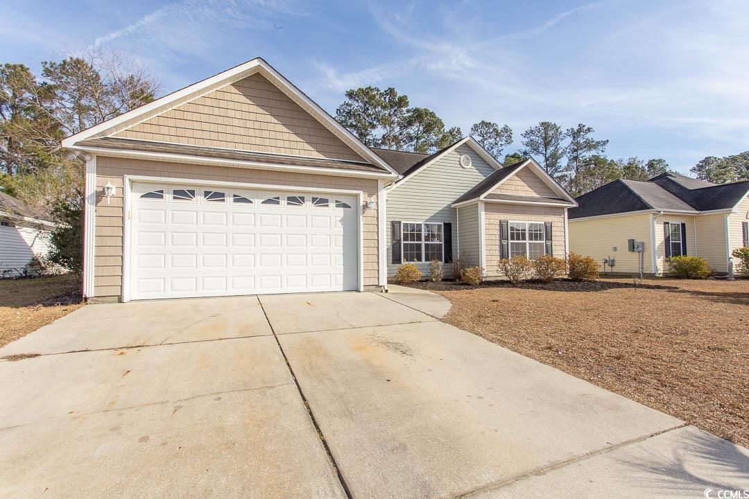 202 Sugar Mill Loop Myrtle Beach, SC 29588 - Photo 37 of 39 View of yard featuring a storage shed and a patio