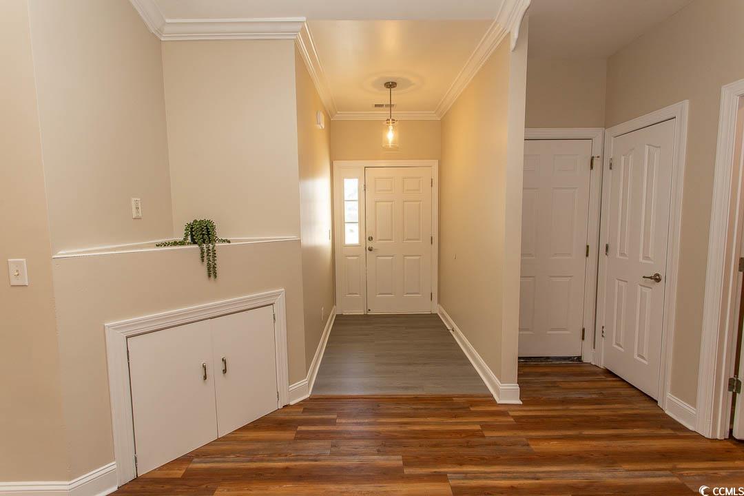202 Sugar Mill Loop Myrtle Beach, SC 29588 - Photo 4 of 39 Doorway to outside with ornamental molding and dar