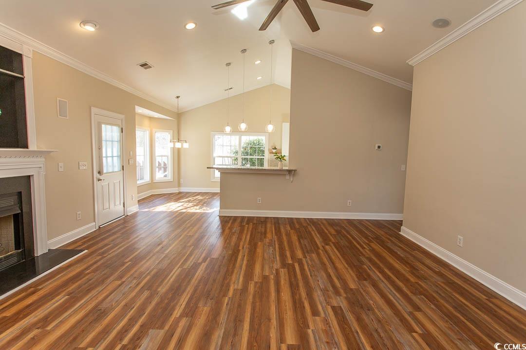 202 Sugar Mill Loop Myrtle Beach, SC 29588 - Photo 5 of 39 Unfurnished living room with ornamental molding, c