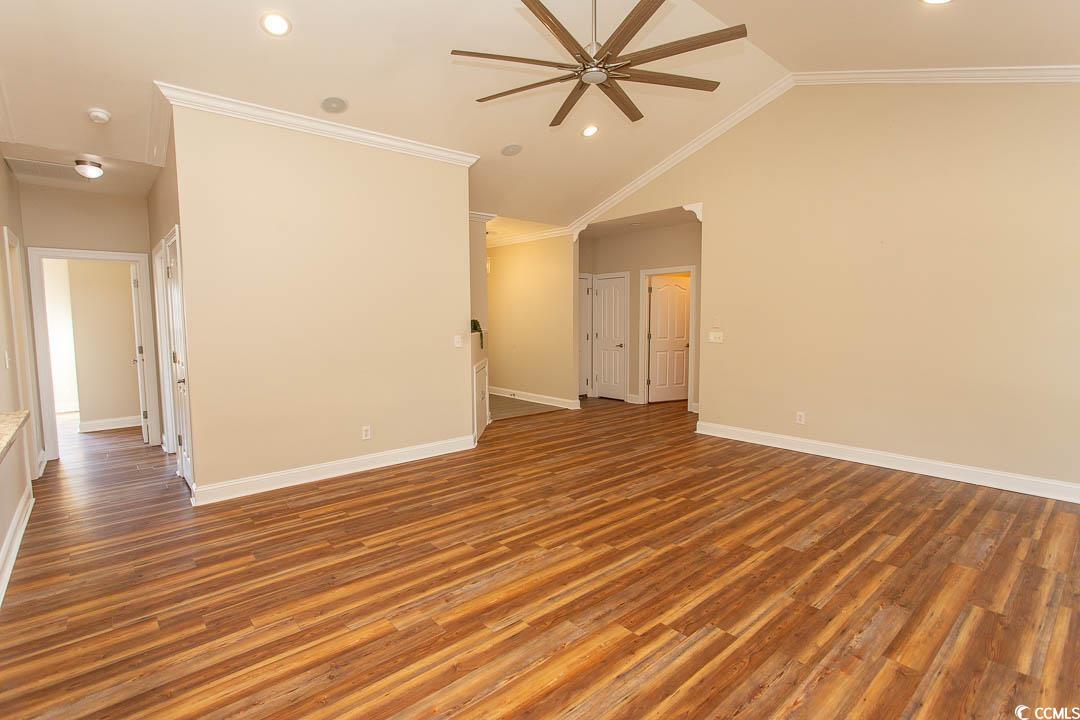 202 Sugar Mill Loop Myrtle Beach, SC 29588 - Photo 8 of 39 Unfurnished living room with lofted ceiling, ornam