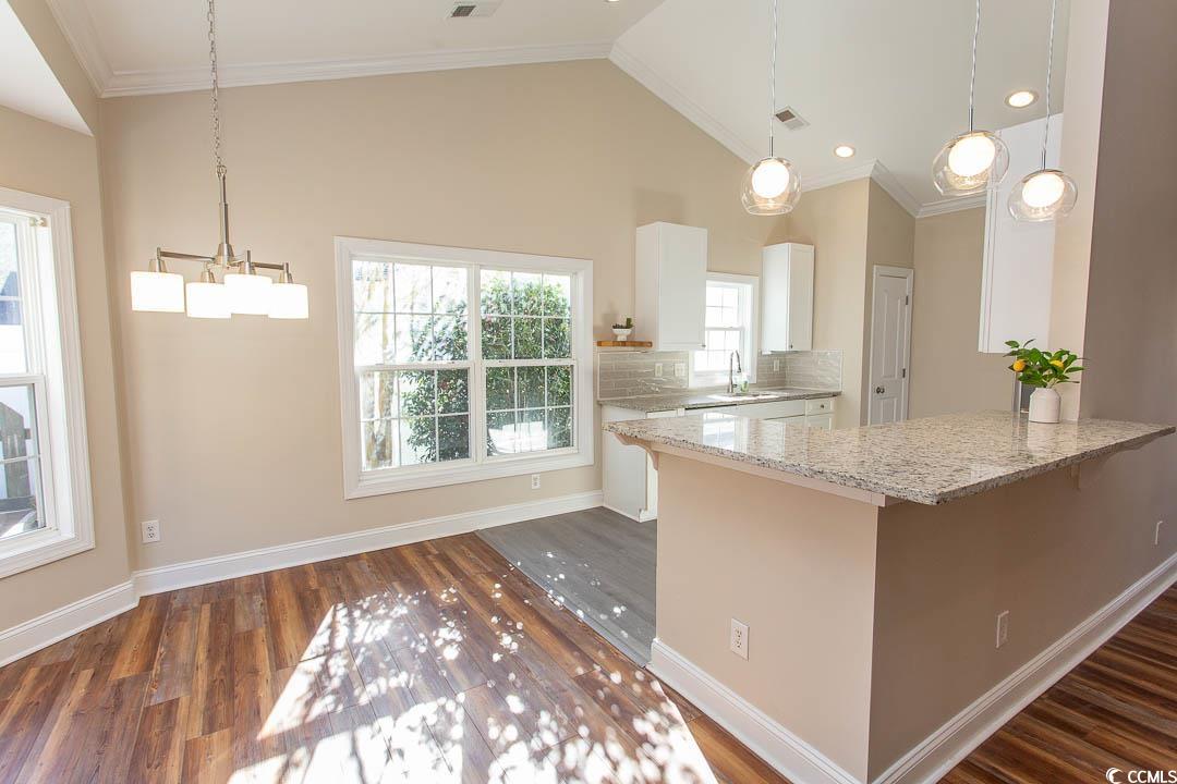 202 Sugar Mill Loop Myrtle Beach, SC 29588 - Photo 9 of 39 Unfurnished room with lofted ceiling, ornamental m