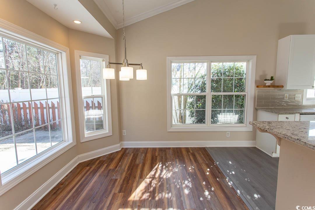 202 Sugar Mill Loop Myrtle Beach, SC 29588 - Photo 10 of 39 Kitchen featuring ornamental molding, white cabine