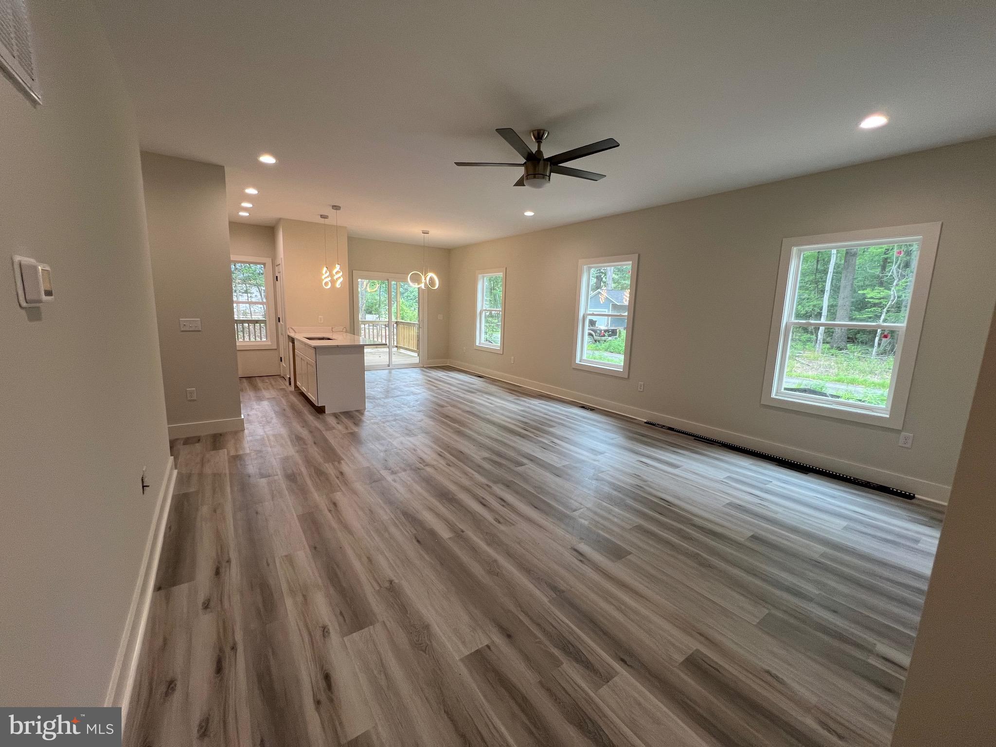 175 Rose Way Colonial Beach, VA 22443 - Photo 22 of 33 an empty room with wooden floor and windows