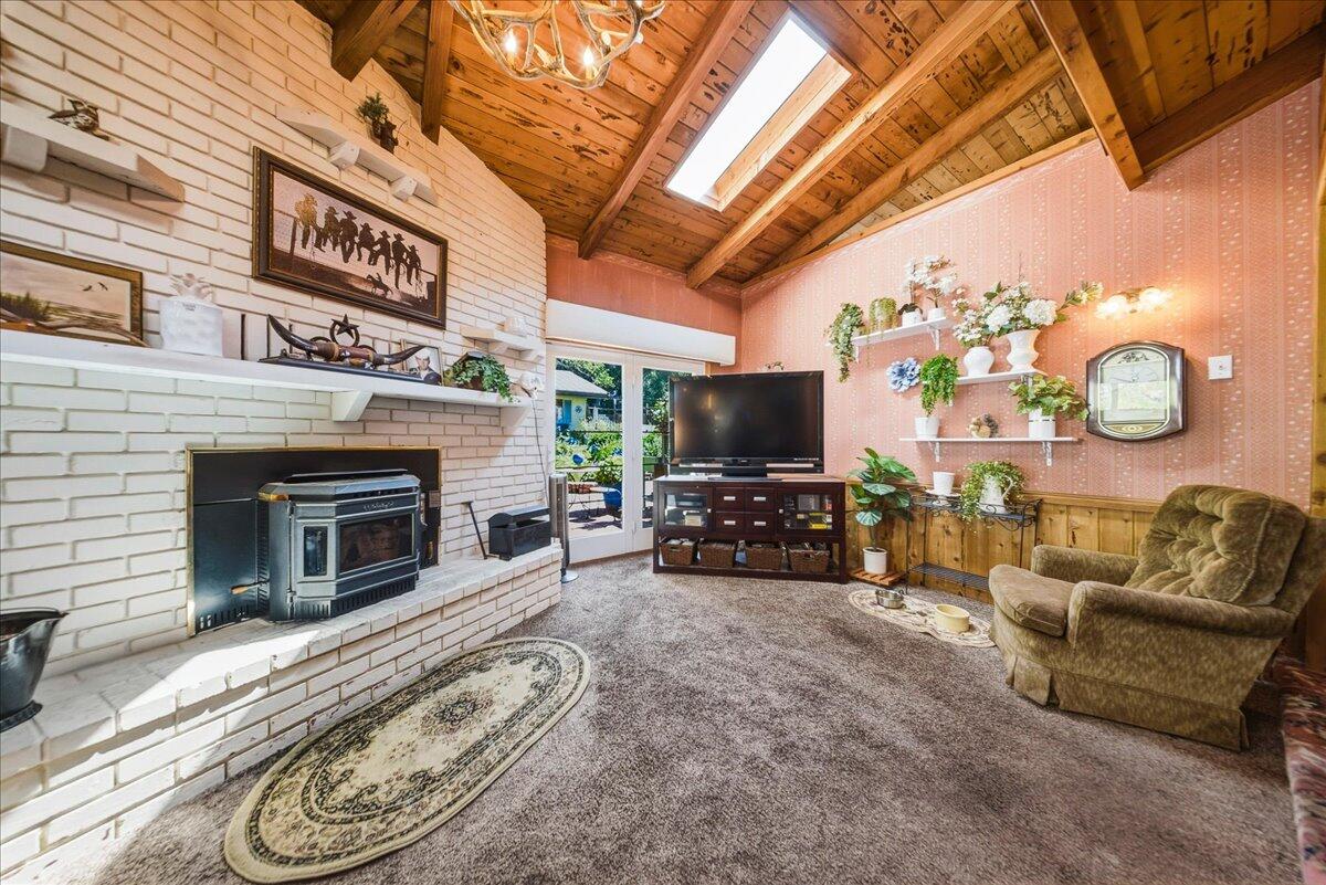 6645 Fern Canyon Road San Luis Obispo, CA 93401 - Photo 15 of 44 a living room with furniture and a flat screen tv