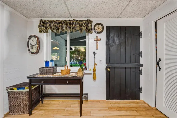 a room with a table and a clock on wall
