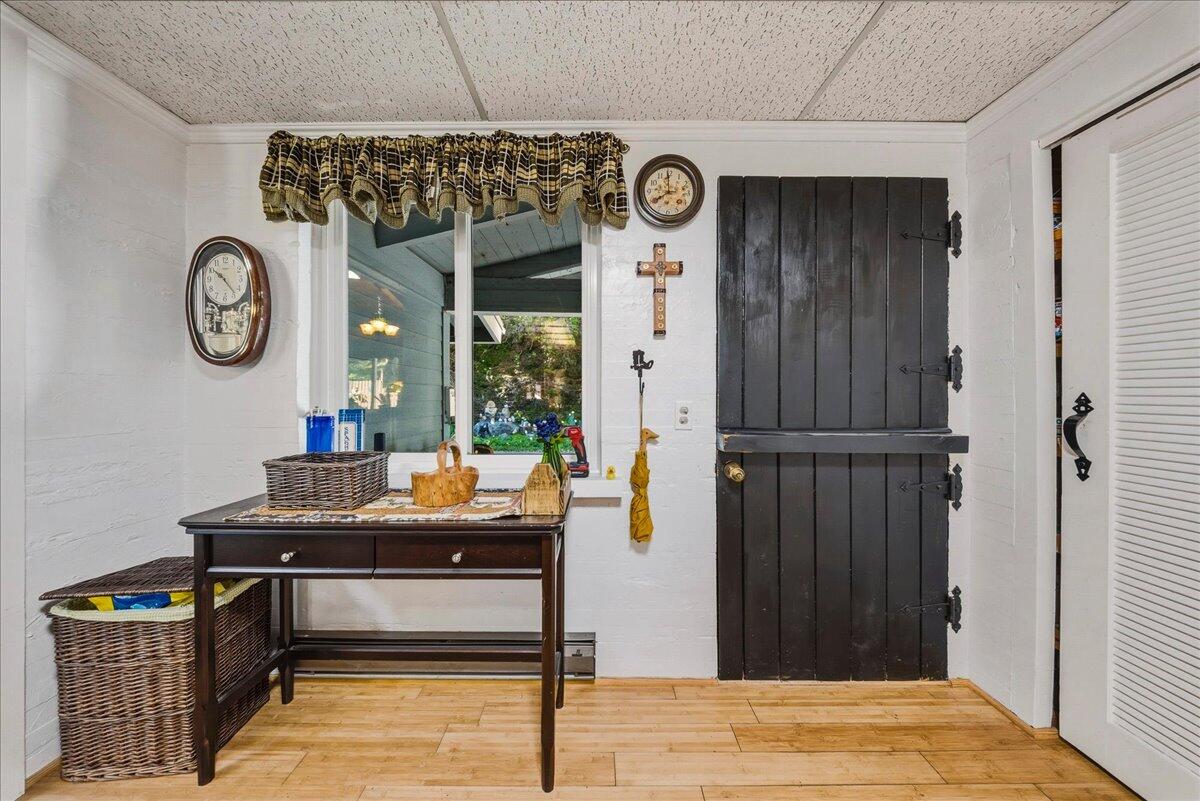6645 Fern Canyon Road San Luis Obispo, CA 93401 - Photo 27 of 44 a room with a table and a clock on wall