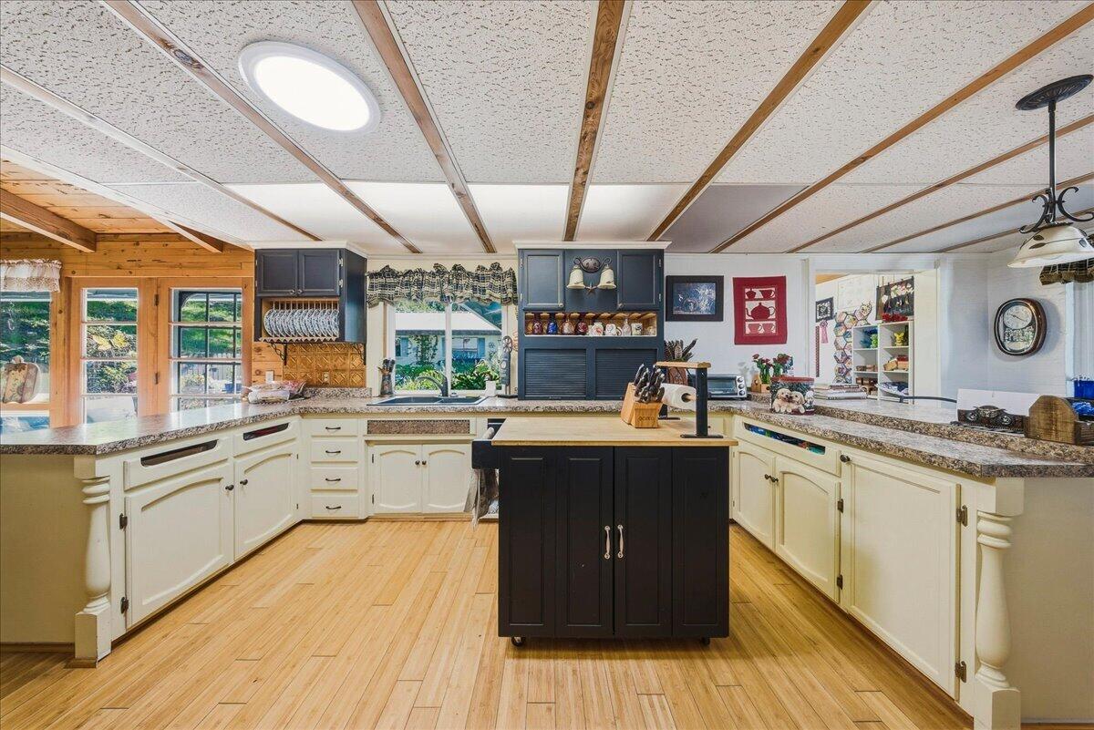 6645 Fern Canyon Road San Luis Obispo, CA 93401 - Photo 29 of 44 a kitchen with stainless steel appliances granite countertop lots of counter top space and a sink
