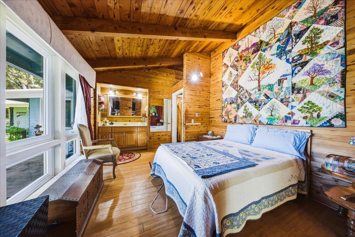 6645 Fern Canyon Road San Luis Obispo, CA 93401 - Photo 36 of 44 a bed room with a bed and a table